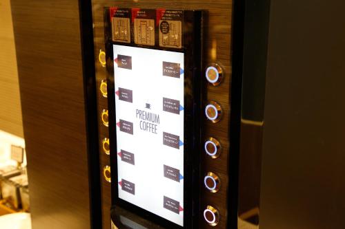 a control panel of an elevator with a menu at The Shiroyama Terrace Tsuyama Villa in Tuyama