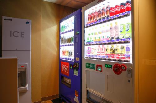 a vending machine filled with drinks in a store at The Shiroyama Terrace Tsuyama Villa in Tuyama