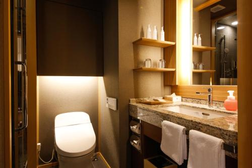 a bathroom with a toilet and a sink at The Shiroyama Terrace Tsuyama Villa in Tuyama