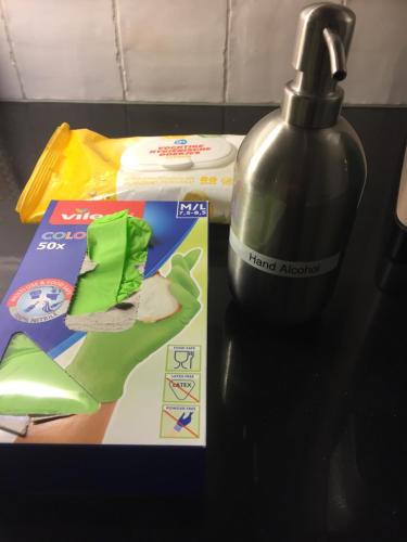 a table with a bottle of detergent and a box at B&B De Willemshoeve in Wageningen