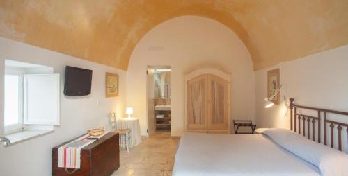 Postel nebo postele na pokoji v ubytování B&B Donna Olga