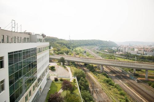 an aerial view of a building and train tracks at Balu Apartments in Prague