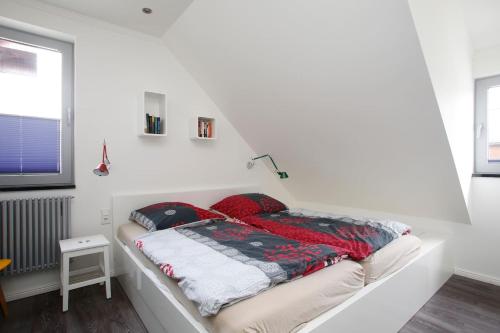 Ein Bett oder Betten in einem Zimmer der Unterkunft Schönes Ferienhaus in Maasholm Bad, Ostsee