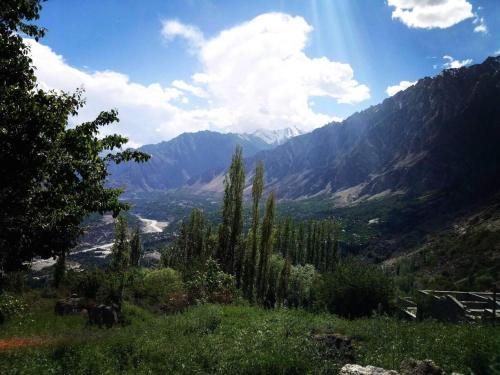 a view of a valley with mountains and trees at Ali Boq Hotel & Restaurant in Hunza Valley