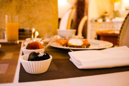 a table with two plates of food on it at Relais Fra' Lorenzo in Verona