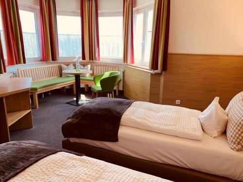 Postel nebo postele na pokoji v ubytování Isar Hotel