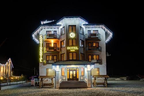 a hotel with lights in front of it at night at Continental SPA Resort in Bukovel