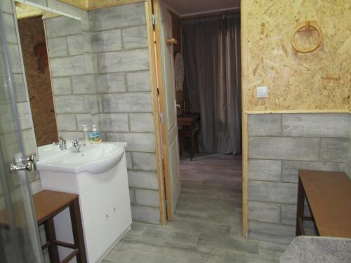 a bathroom with a sink and a mirror at Appartement en bois in Sète