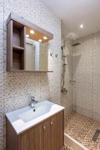 a bathroom with a sink and a shower at Galini Apartments in Hersonissos