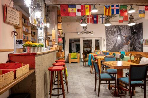 a restaurant with tables and chairs and a bar at Trafo Base Camp in Kroczyce