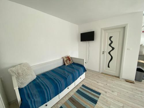 En eller flere senge i et værelse på Casa Bunicilor Granny's House