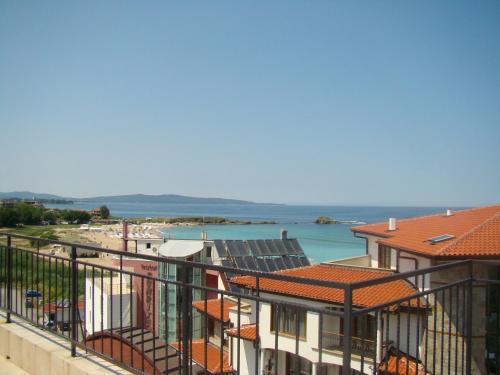 a view of the ocean from the balcony of a building at Hotel Bellisimo in Lozenets