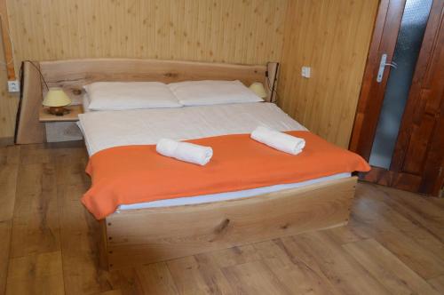 A bed or beds in a room at Drevený raj