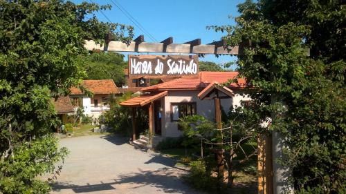 a building with a sign that reads inn sidx sidx sidx at Pousada Mares do Santinho in Florianópolis