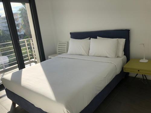 Posteľ alebo postele v izbe v ubytovaní Elion Luxury Apartments