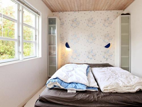 a bedroom with a bed and a window at 6 person holiday home in Store Fuglede in Store Fuglede
