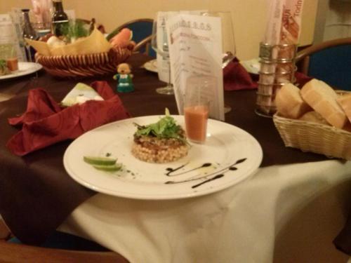 a plate of food on top of a table at Locanda San Marco in Torri del Benaco