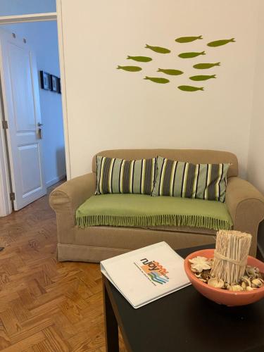a living room with a couch and a table at Enjoy Mouraria Apartments in Lisbon