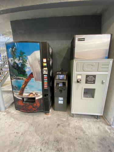 a gas pump and an atm machine in a building at Golden West Manor Motel in Los Angeles