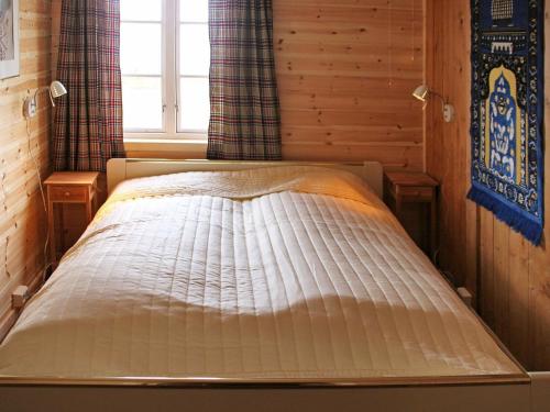 a bed in a room with a window at One-Bedroom Holiday home in Gravdal in Gravdal