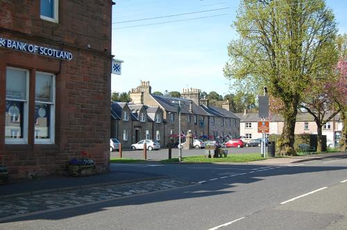 a street in a small town with a brick building at The Old Bakehouse in Newcastleton