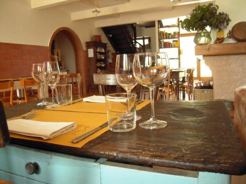 a table with wine glasses on top of it at Agriturismo Ponterosa in Morrovalle