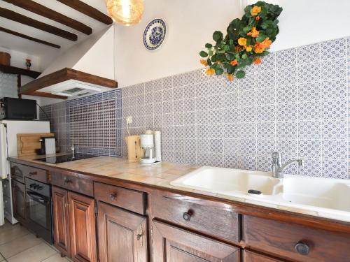 a kitchen with a sink and a counter at Saint-Sauveur Hideaway in Saint-Michel-de-la-Pierre