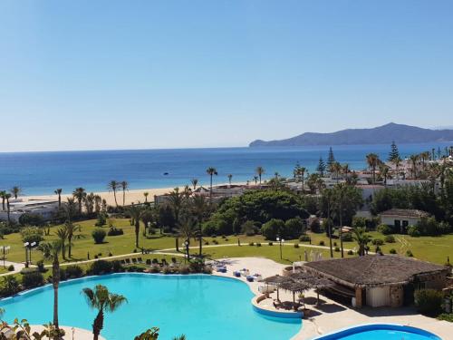 an aerial view of a resort with a swimming pool and the beach at Marina Smir Hotel & Spa in M'diq