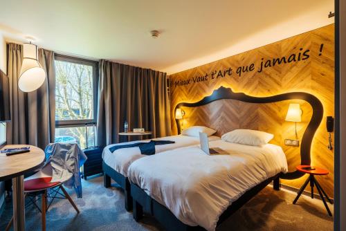 Postel nebo postele na pokoji v ubytování ibis Styles Douai Gare Gayant Expo