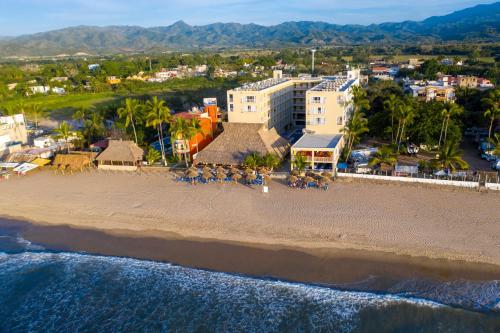 an aerial view of a beach with a resort at Decameron Isla Coral Guayabitos, Ramada All-Inclusive Resort in Rincon de Guayabitos