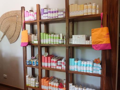 a book shelf filled with lots of bottles of cosmetics at Paradise Cove Resort in Naukacuvu Island