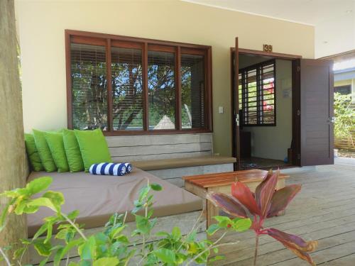 a living room with a couch and a table at Paradise Cove Resort in Naukacuvu Island