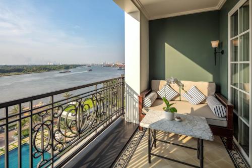 a balcony with a view of the river at Mia Saigon – Luxury Boutique Hotel in Ho Chi Minh City