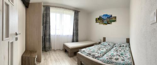 Posteľ alebo postele v izbe v ubytovaní Apartmán Pod Klinom