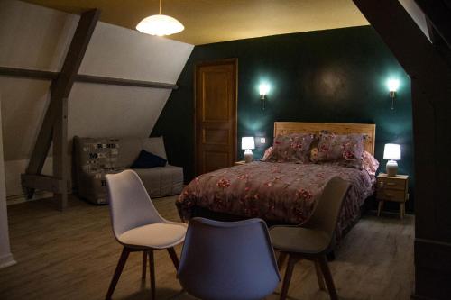 Łóżko lub łóżka w pokoju w obiekcie chaumière de l'épine