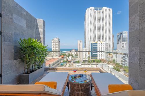 a balcony with a view of the city at Platinum Danang Hotel in Da Nang