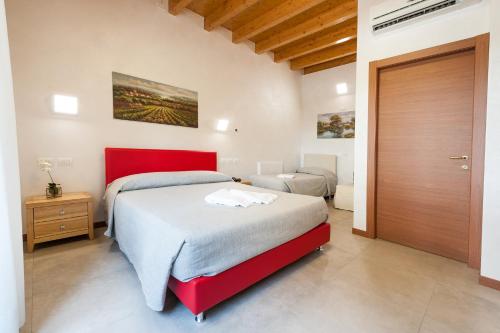 Cama o camas de una habitación en Agricampeggio Corte Tonolli