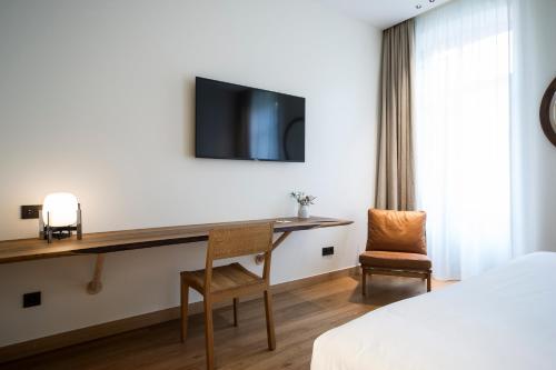 TV a/nebo společenská místnost v ubytování Hotel Arbaso