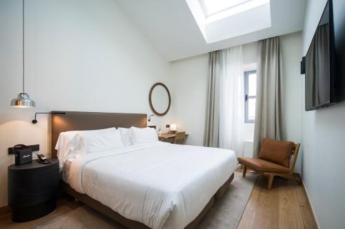 Posteľ alebo postele v izbe v ubytovaní Hotel Arbaso