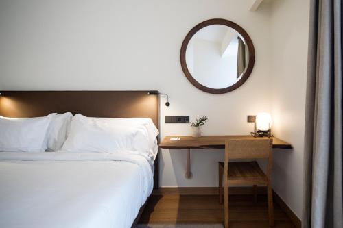 Postel nebo postele na pokoji v ubytování Hotel Arbaso