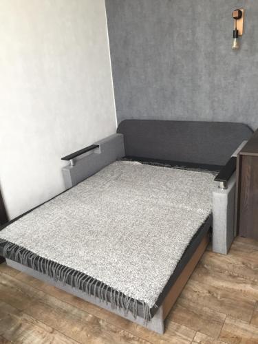 a small bed in a room with a mattress at Однокімнатна квартира-студія біля парку Шевченка in Ivano-Frankivsk