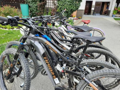 a row of bikes parked next to each other at Snežak (Snowman) 2 in Bohinj