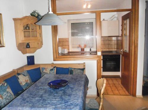 a small kitchen with a table in a tiny house at Ferienwohnung Ilka Plank in Füssen