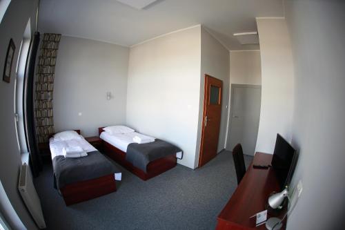 Postel nebo postele na pokoji v ubytování Hotel Centrum