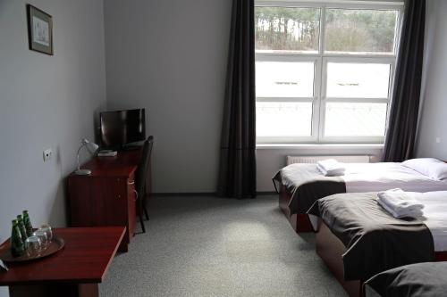 Postel nebo postele na pokoji v ubytování Hotel Centrum