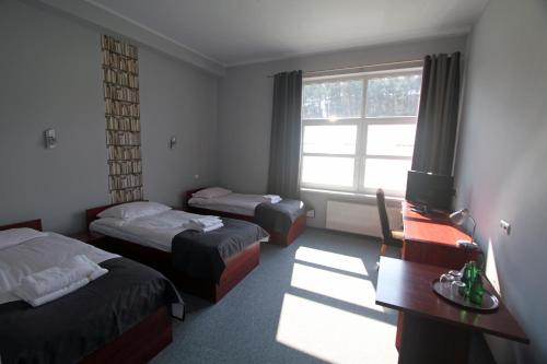 Postel nebo postele na pokoji v ubytování Hotel Centrum