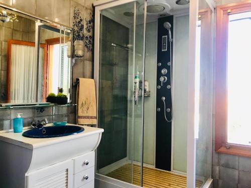 a bathroom with a sink and a shower at La Aldea in Aldea del Fresno