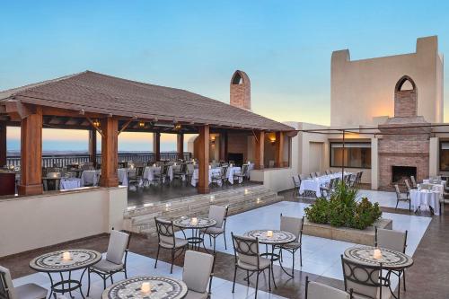 a restaurant with tables and chairs on a patio at Steigenberger Aqua Magic, All inclusive in Hurghada