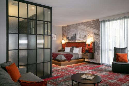 a hotel room with a bed and a couch at Bobby Hotel in Nashville