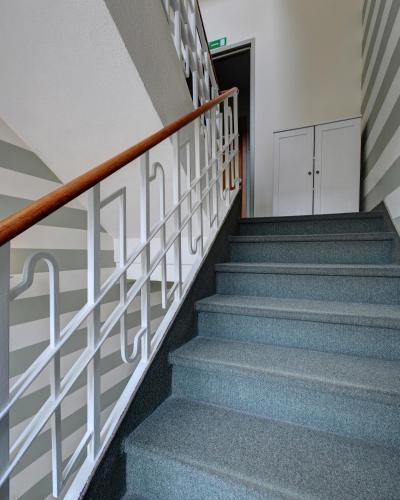 a staircase in a building with blue stairs at Astor Hotel in Turin